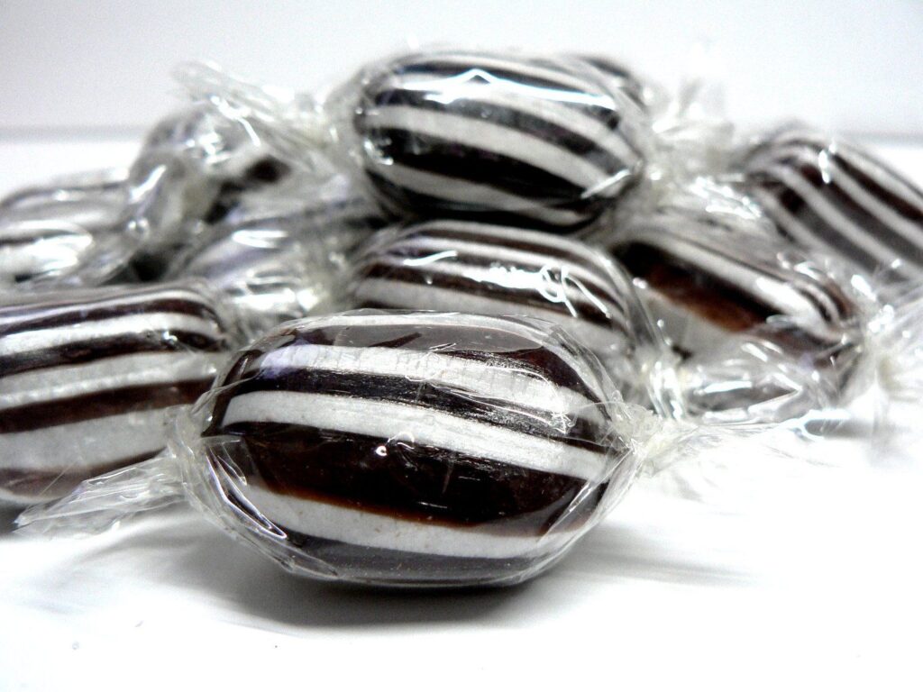 close-up of mint humbugs (black and white striped hard candy)