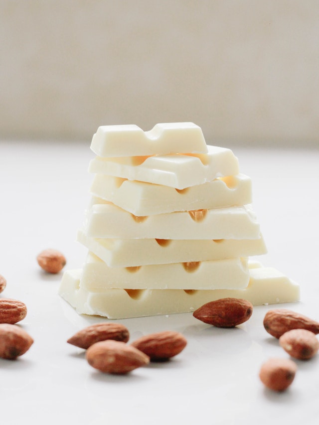 squares of white chocolate surrounded by whole almonds