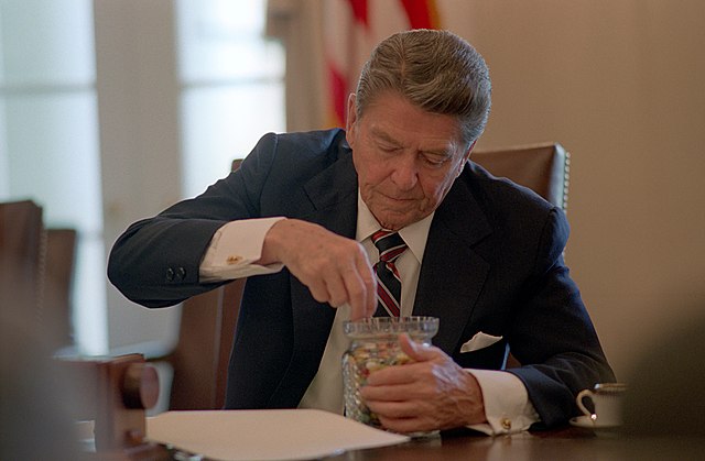 President Ronald Reagan enjoying a jar of jelly beans