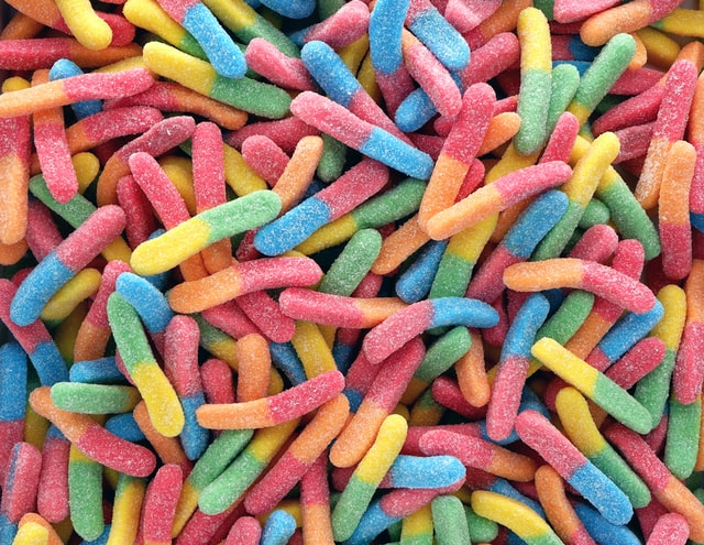 assortment of sour gummy worm candy